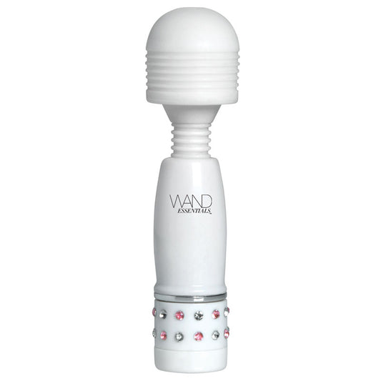 Close-up of a small, lilac massage wand with a smooth, rounded head for focused use.