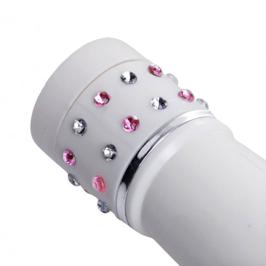 Close-up of a small, silver-tone massage wand with a smooth, metallic finish.