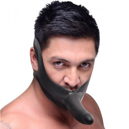 master series face strap on and mouth gag featuring a black dildo restraint