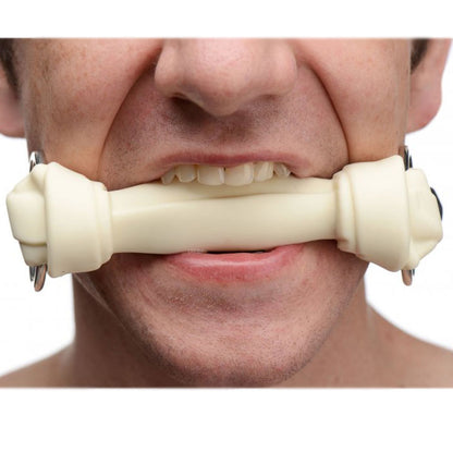 red silicone dog bone gag from the master series, a playful bondage restraint