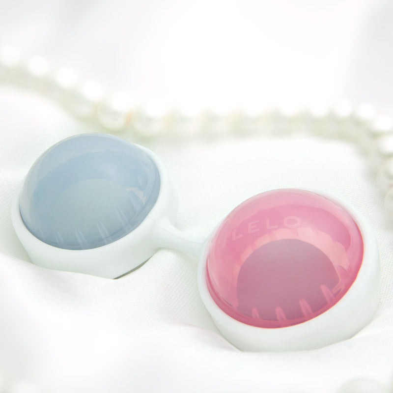 Lelo luna beads mini, pink and blue weighted exercise balls for pelvic floor toning.
