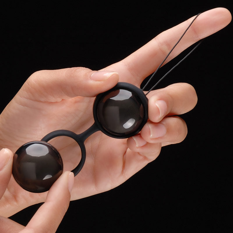 A set of black, weighted kegel beads by Lelo, for pelvic floor exercise.