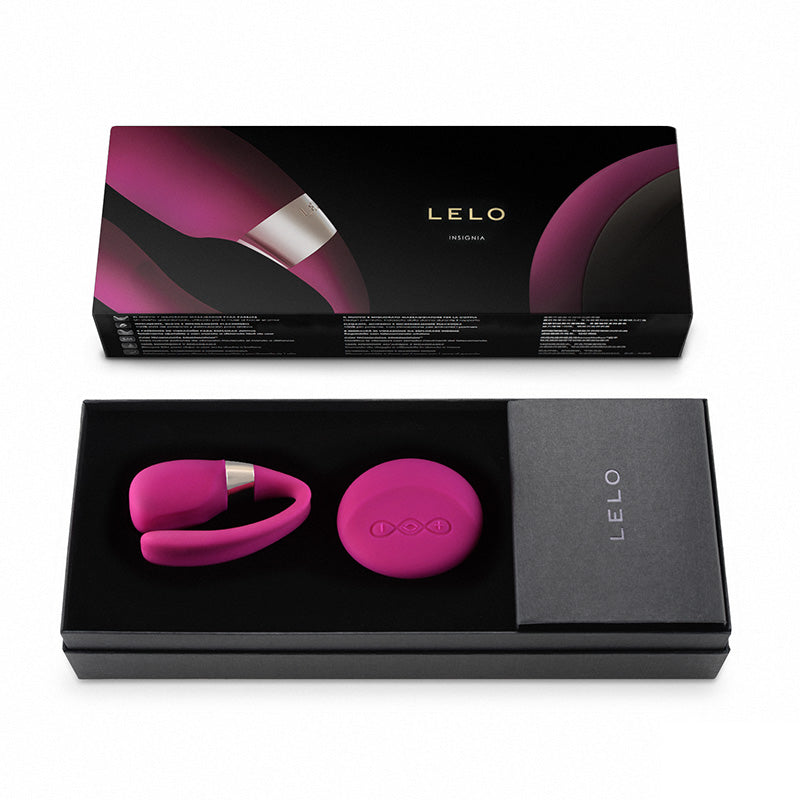 Close-up of a cherry-red Lelo Tiani 3 rechargeable massager with a smooth, luxurious finish.