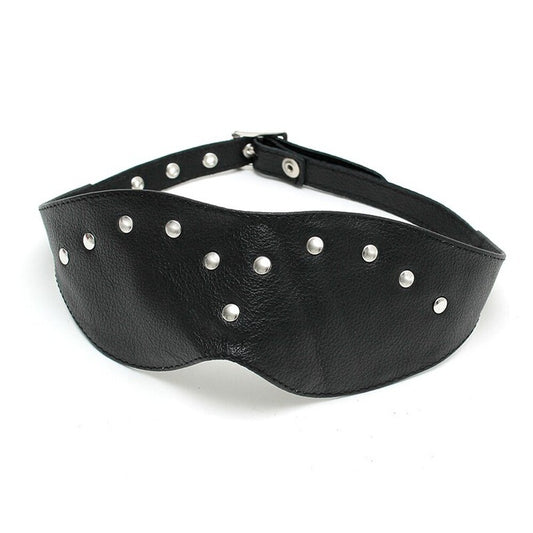 Close-up of a Rimba leather blindfold mask, showing the soft black material and stitching.
