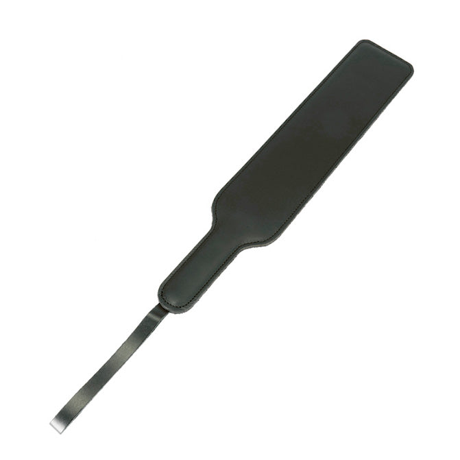 Rimba wide leather paddle, showing the smooth tan leather and sturdy, hand-crafted construction.