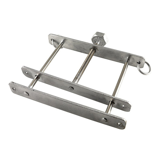 A shiny metal cock and ball crusher for cock and ball bondage play, Rimba.